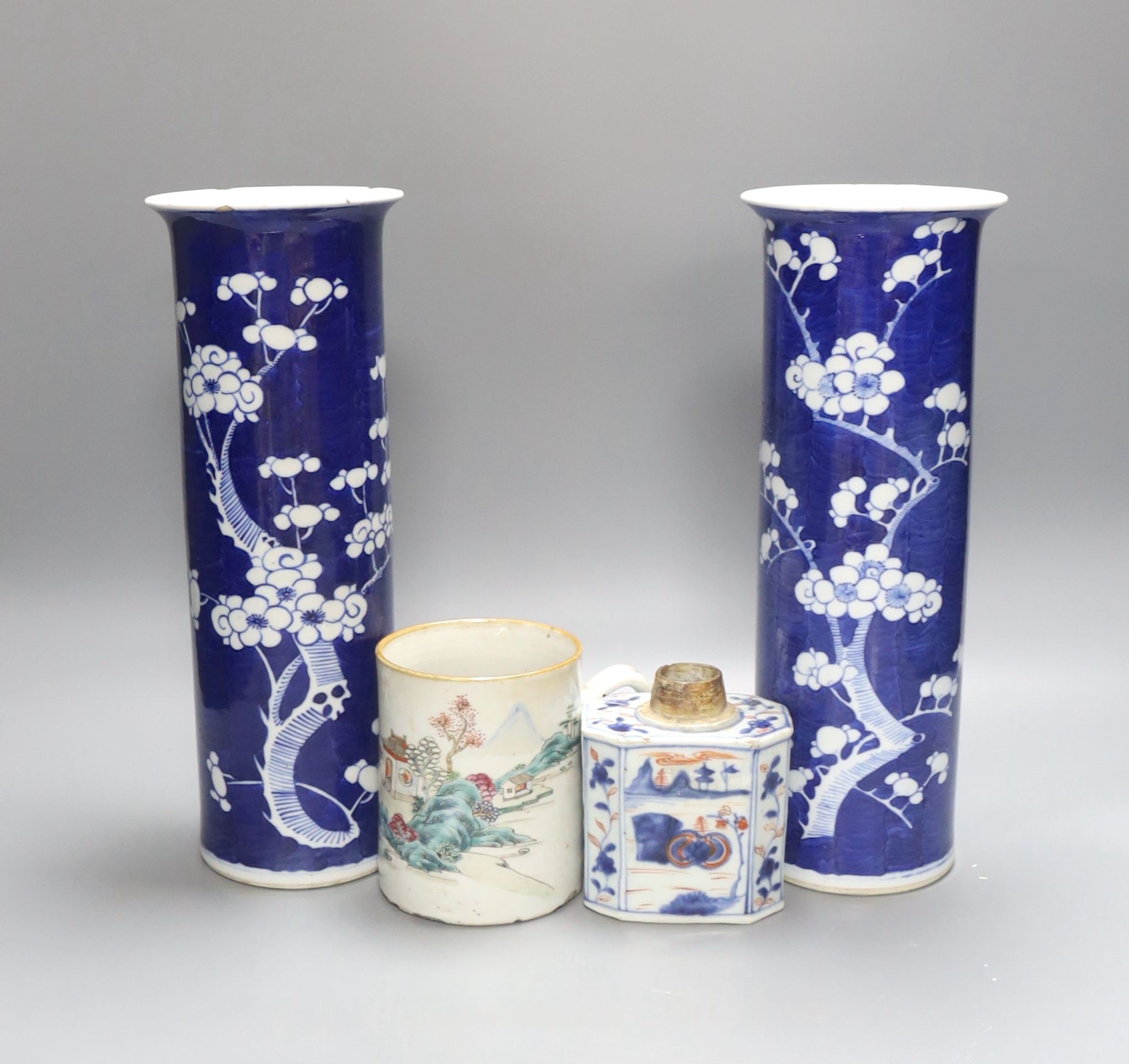 An 18th century Chinese famille rose mug, a Chinese Imari tea caddy and two Chinese blue and white sleeve vases 30cm (4)